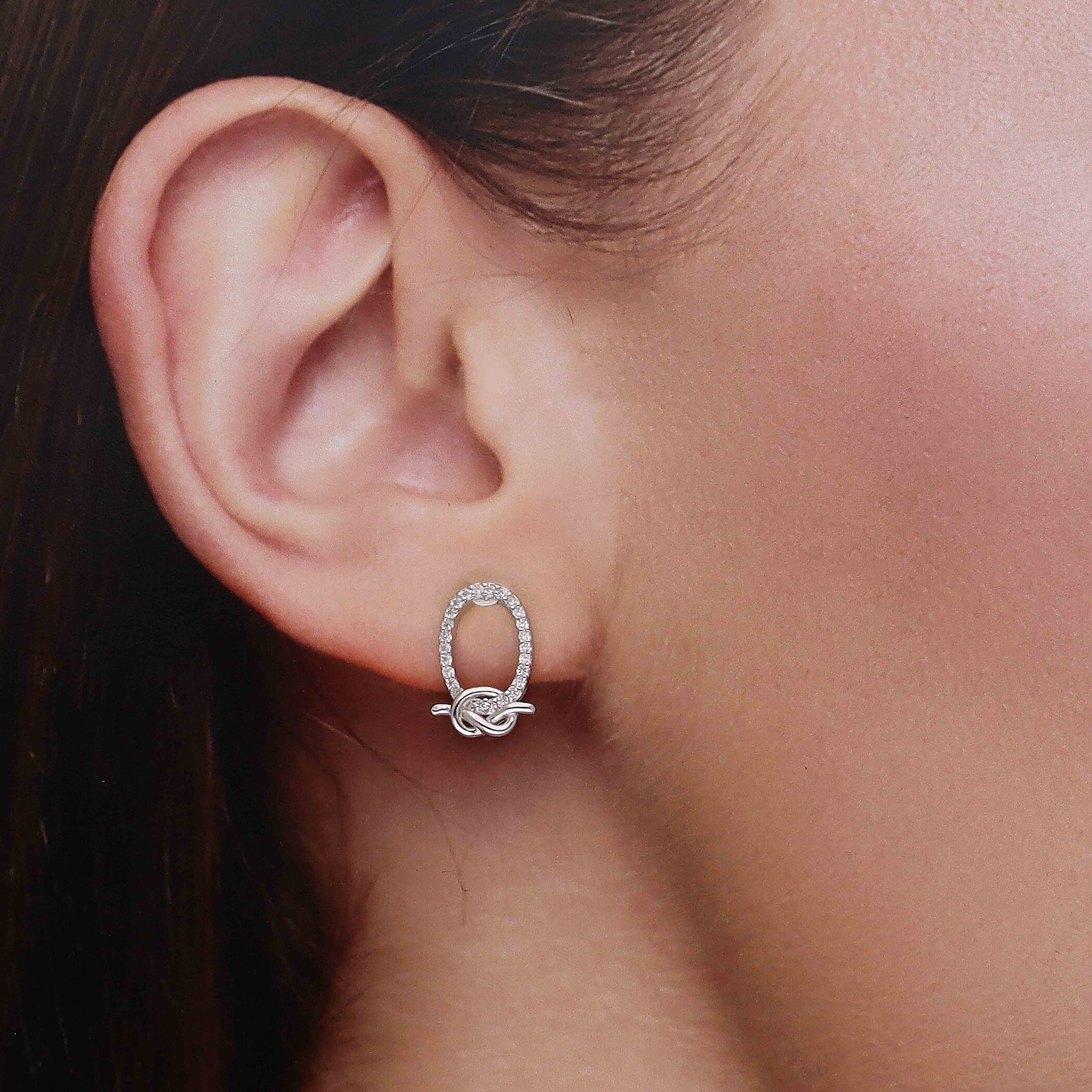 Elegant Silver Oval Knot Stud Earrings - Image 4